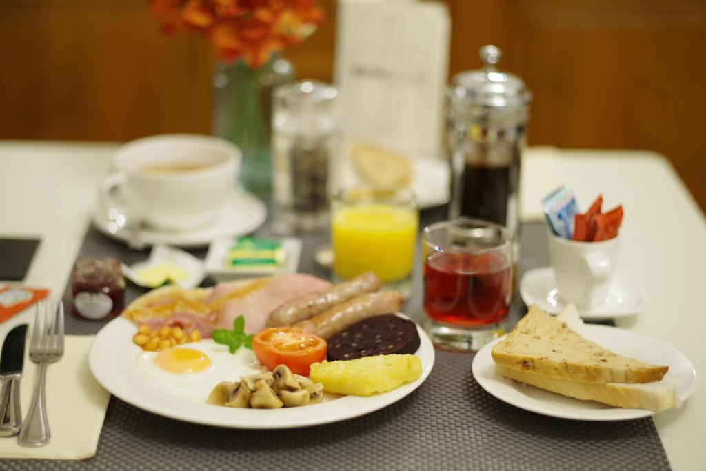 Two plates of full cooked English breakfast