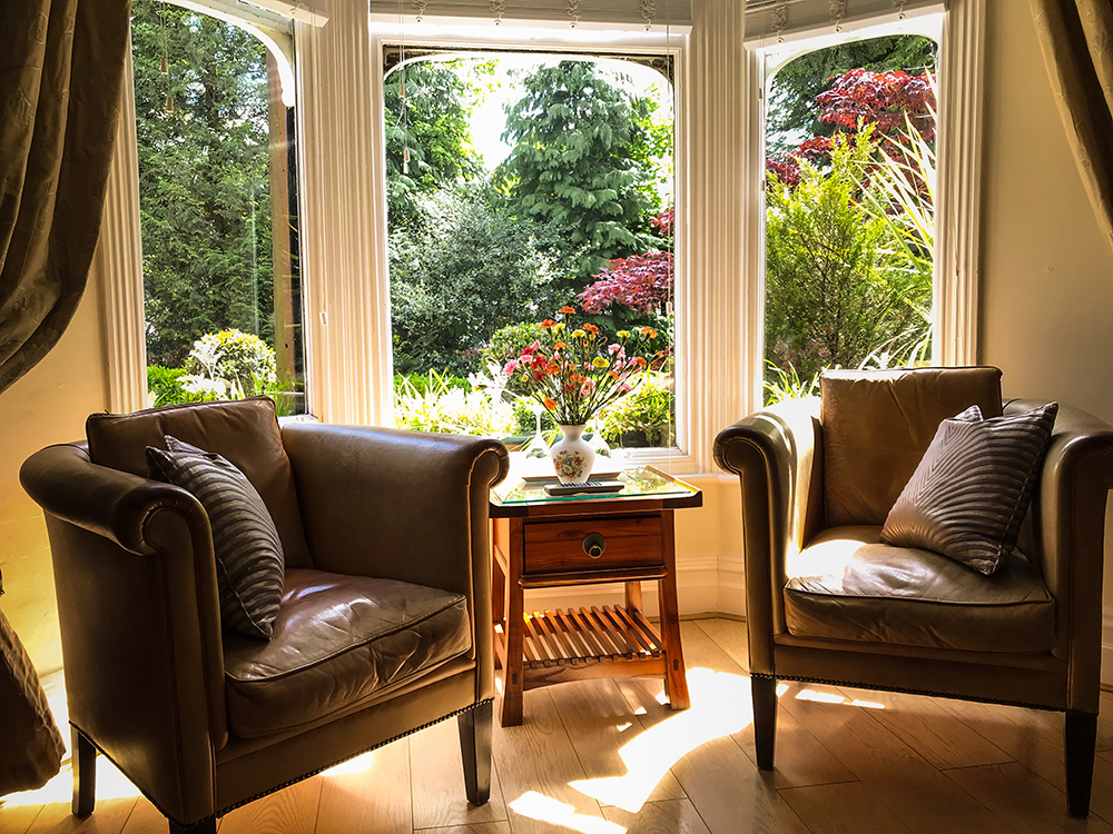 Residents lounge with bay window overlooking the garden